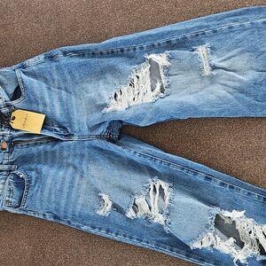 High rise wide leg distressed jean. Rigid denim. Size 7. 34 inseam